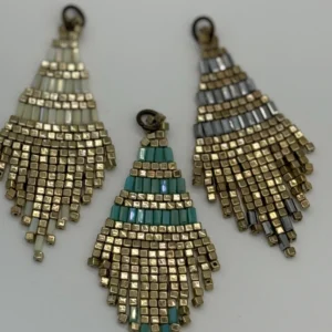 Three different colored beads are hanging from a metal chain.