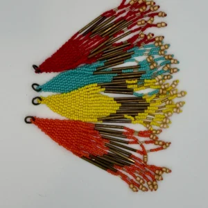 A group of colorful beads hanging on the wall.