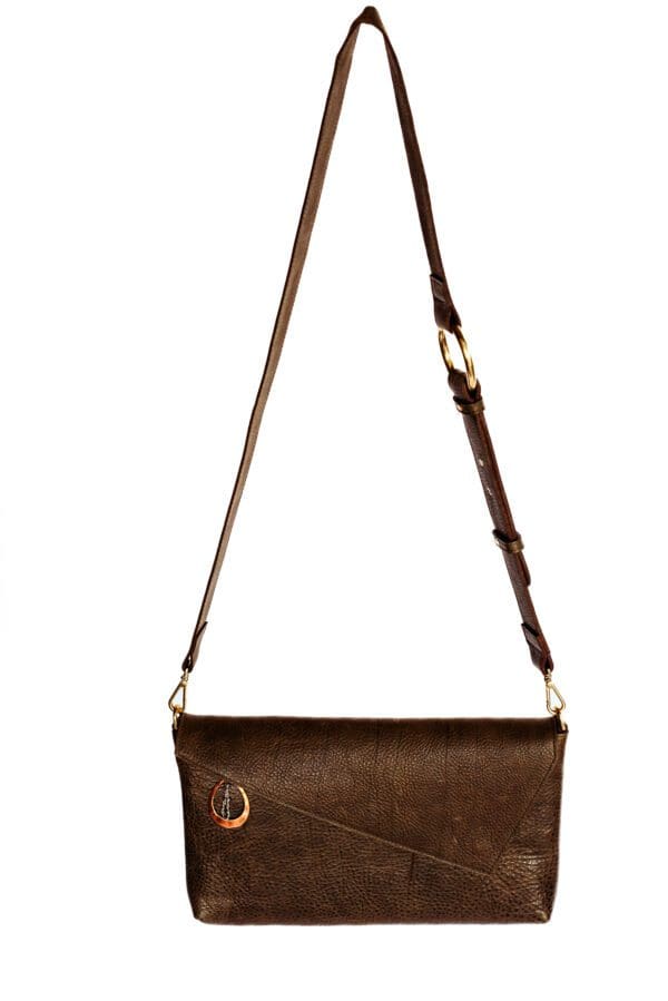 A brown purse with a gold chain hanging from it.