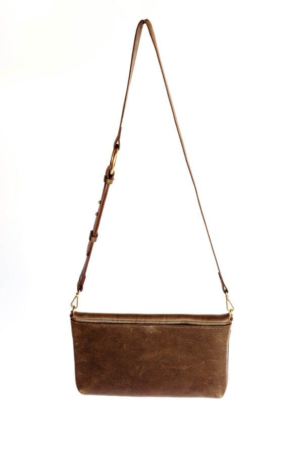 A brown purse hanging on a string.