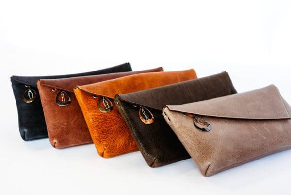 A row of four clutches in different colors.