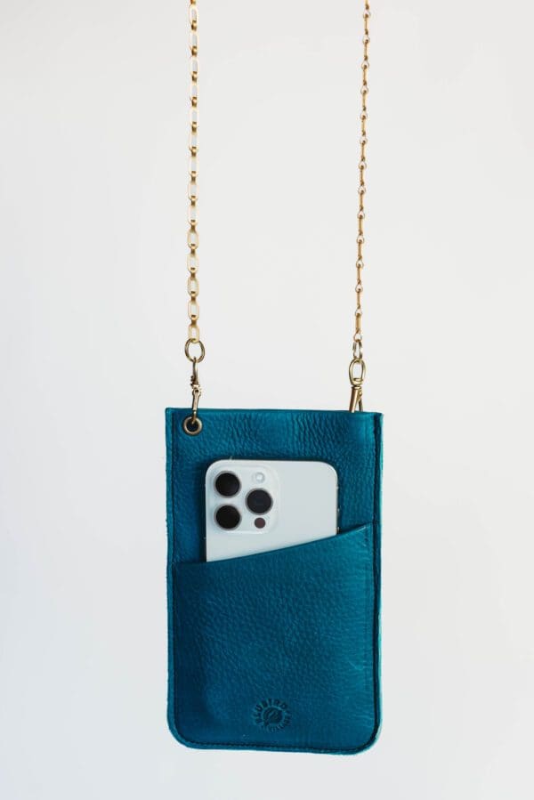 A phone case with a chain hanging off of it.