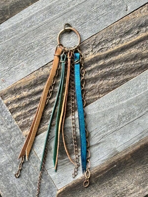 A key chain with multiple colored leather tassels.