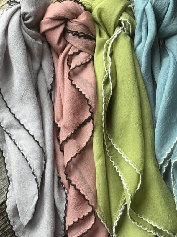 A group of scarves that are all different colors.