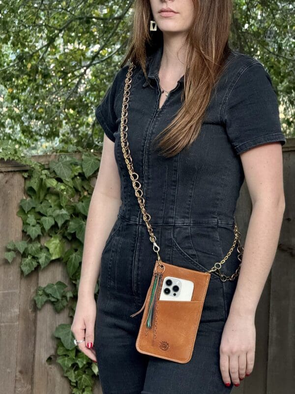 A woman holding her phone in front of her face.