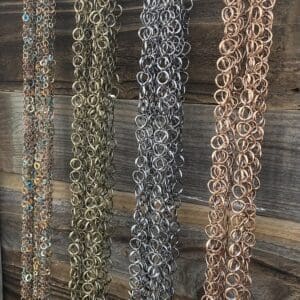 A bunch of chains hanging on the wall