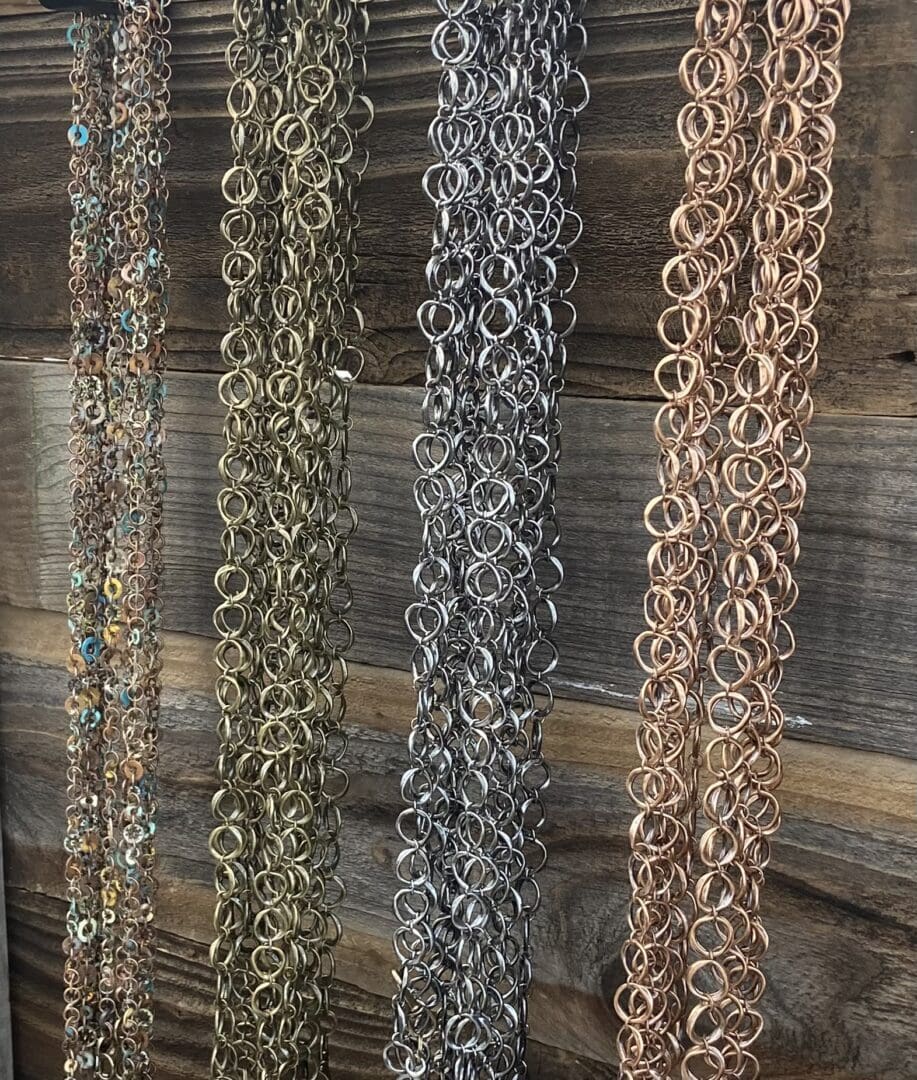 A bunch of chains hanging on the wall