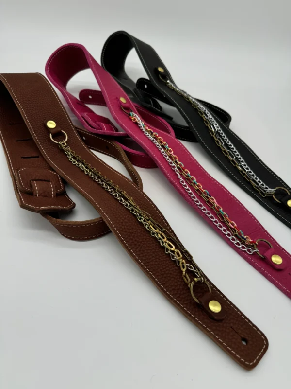 A group of four different colored straps with chains.