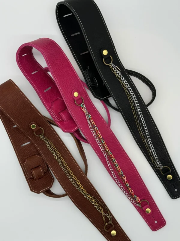 A group of four different colored straps with chains.