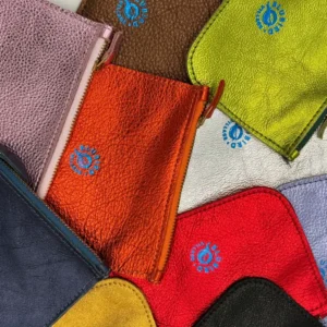 A close up of several different colored towels