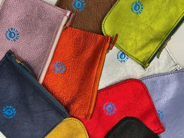 A close up of several different colored towels